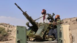 Taliban fighters look up while manning an armed pickup truck at the Afghan side of the Ghulam Khan crossing with Pakistan in Khost province, Afghanistan, Friday, Feb. 27, 2026. AP/PTI(AP02_27_2026_000167B)