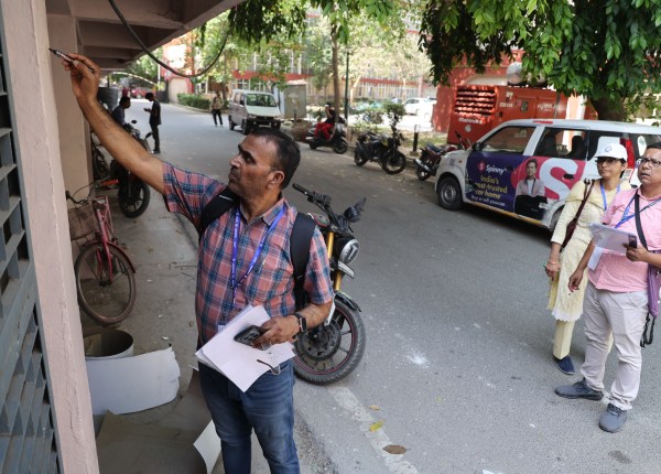 Census enumerators survey at the Civil service officers institute at KG Marg on the first day of Census in New Delhi. (Express Photo by Tashi Tobgyal)