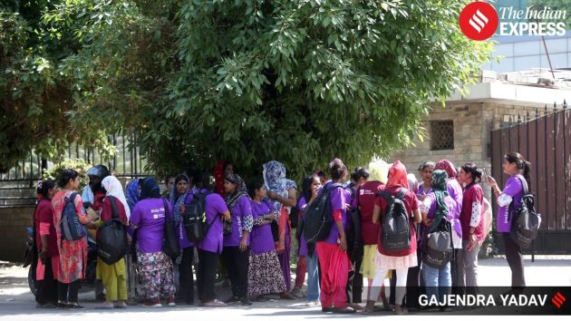 A group of around forty women gig workers employed with Urban Company gathered outside a training centre