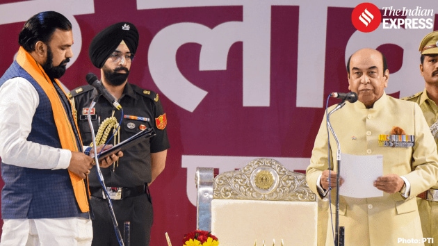 Governor Lt Gen Syed Ata Hasnain (retd) administers the oath of office and secrecy to Samrat Choudhary