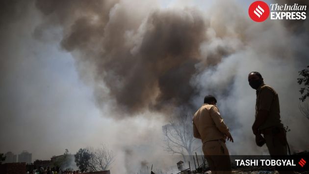 Thick smoke and flames quickly spread through the cluster of shanties