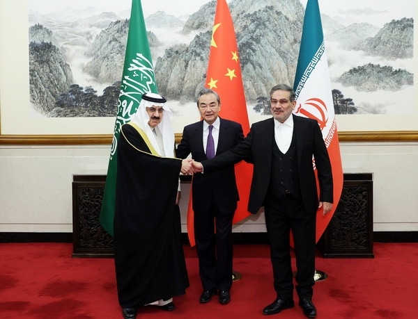Chinese Foreign Minister Wang Yi with the leaders of Saudi Arabia and Iran in Beijing in 2023. (State media)