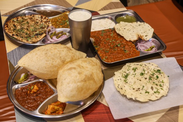 Chole bhature, rajma chawal, Amritsari kulche and lassi at Delhi Se. Express Photos by Akash Patil