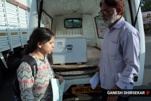 Father Amratlal Solanki and sister Mitali Solanki received the skeletal remains of seafarer Dixit Solanki on Sunday morning (April 5, 2026) at the Mumbai International Airport's cargo section. (Express Photo/Ganesh Shirsekar)