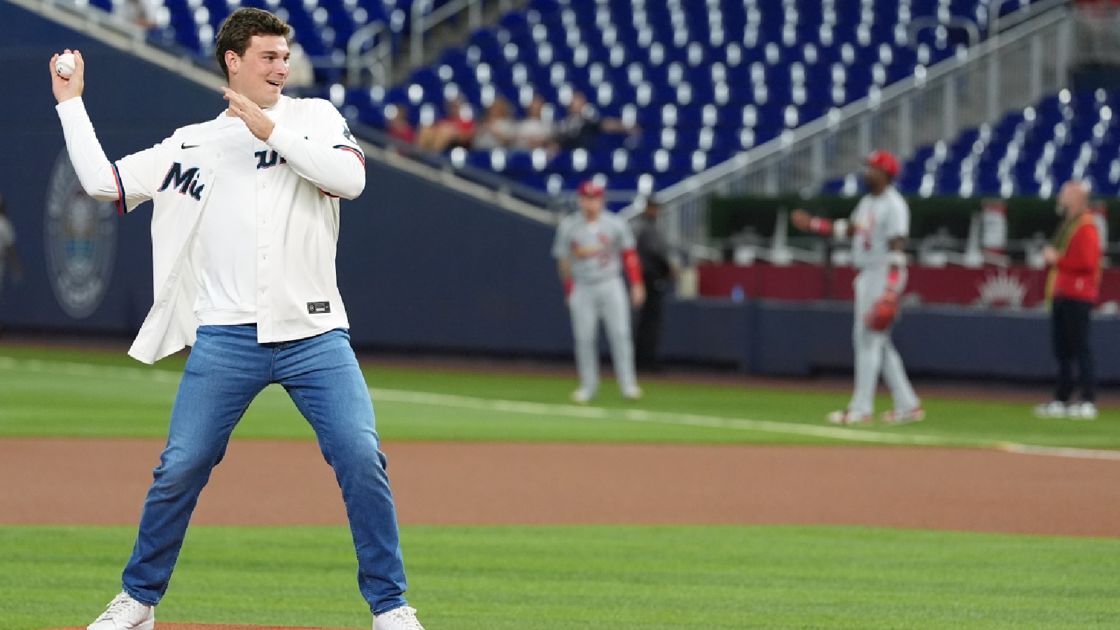 Indiana quarterback Fernando Mendoza throws out the ceremonial first pitch at the start of a baseball game between the Miami Marlins and the St. Louis Cardinals, Tuesday, April 21, 2026, in Miami. (AP Photo)