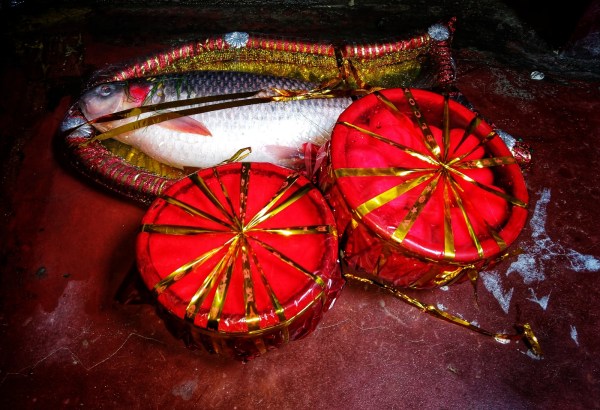 Fish and sweets at a Bengali wedding (Wikipedia)