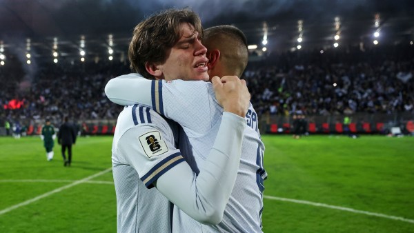 Italy's Marco Palestra, and Leonardo Spinazzola console each other after losing a penalty shootout during the World Cup qualifying playoff final match vs Bosnia. (PHOTO: AP)