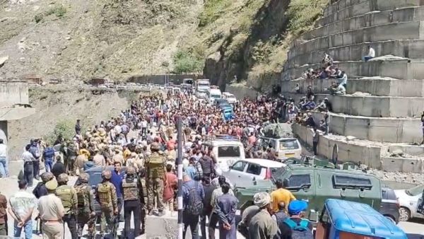 People blocking Jammu-Srinagar national highway in protest against cow vigilantes who assaulted a local youth carrying a bovine animal home in a vehicle. (Express Photo)