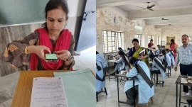 Teachers scanning the answer sheets using the AI app
