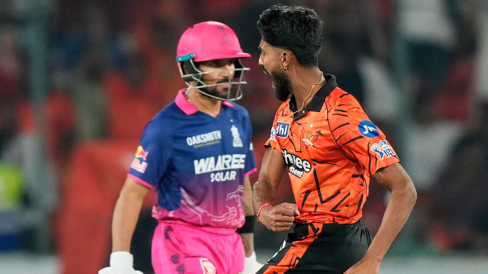 Rajasthan Royals' Praful Hinge celebrates the wicket of Rajasthan Royals' Dhruv Jurel, left, during the Indian Premier League cricket match between Sunrisers Hyderabad and Rajasthan Royals in Hyderabad, India, Monday, April 13, 2026. (AP Photo)