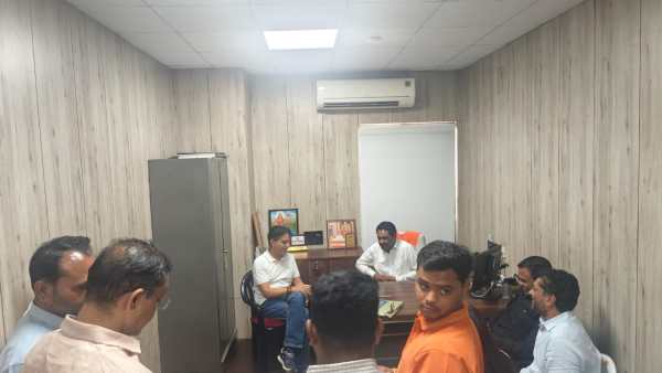 State education minister Praful Pansheriya (in the white T-shirt) at the BJP office 