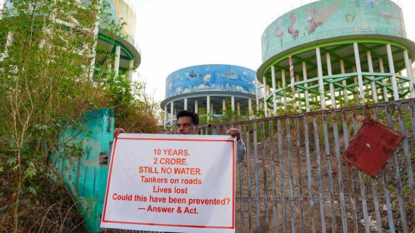 Three water tanks built eight years ago near Royale Heritage Mall in Mohammedwadi. The non-functional facility has led to heavy water tanker traffic in the area. (Express photo/Arul Horizon)