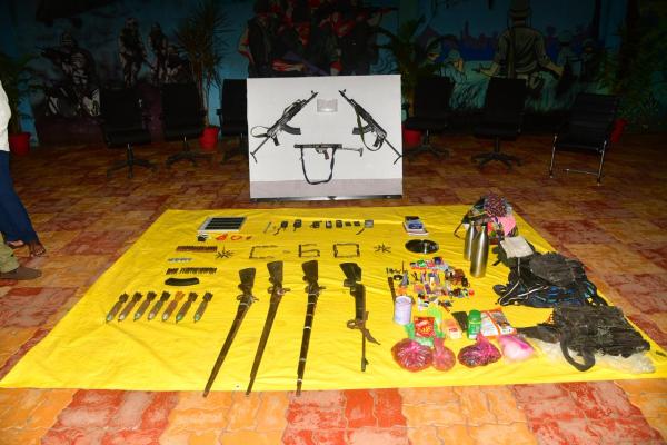 The police recovered arms and materials from the Kumnar forest area along the Maharashtra–Chhattisgarh border, including an AK-47 rifle, three magazines, 57 live rounds, three walkie-talkies, four batteries, and 20 pen drives (Express)