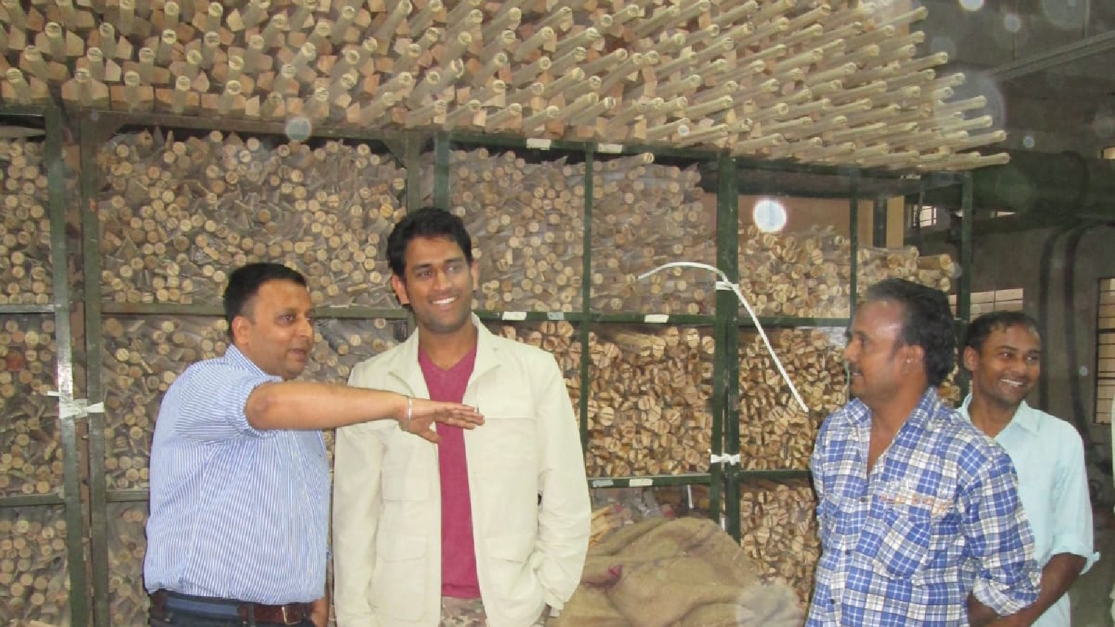 SS's Jatin Sareen with a young MS Dhoni during the cricketer's visit to the bat-making unit in Meerut. (Photo by special arrangement)