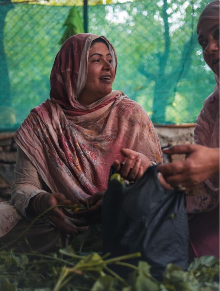 Two women prepare food in a Kargili kitchen. Picture by author Yash Saxena 