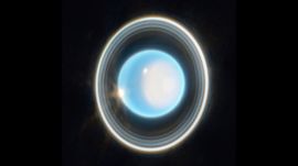 New research highlights stark differences between Uranus's μ- and ν-rings. The μ-ring appears blue, suggesting it is made up of extremely fine icy particles, likely sourced from Mab, one of the planet’s inner moons(Image: ESA)