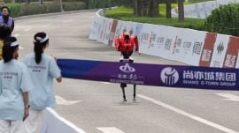 An Honor Lightning humanoid robot runs towards the finish line during the second Beijing E-Town Half Marathon and Humanoid Robot Half Marathon in Beijing, China April 19, 2026.