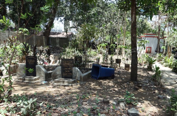  Antop Hill, a red and white shrine stands in sharp contrast to the slum and industrial pockets around it