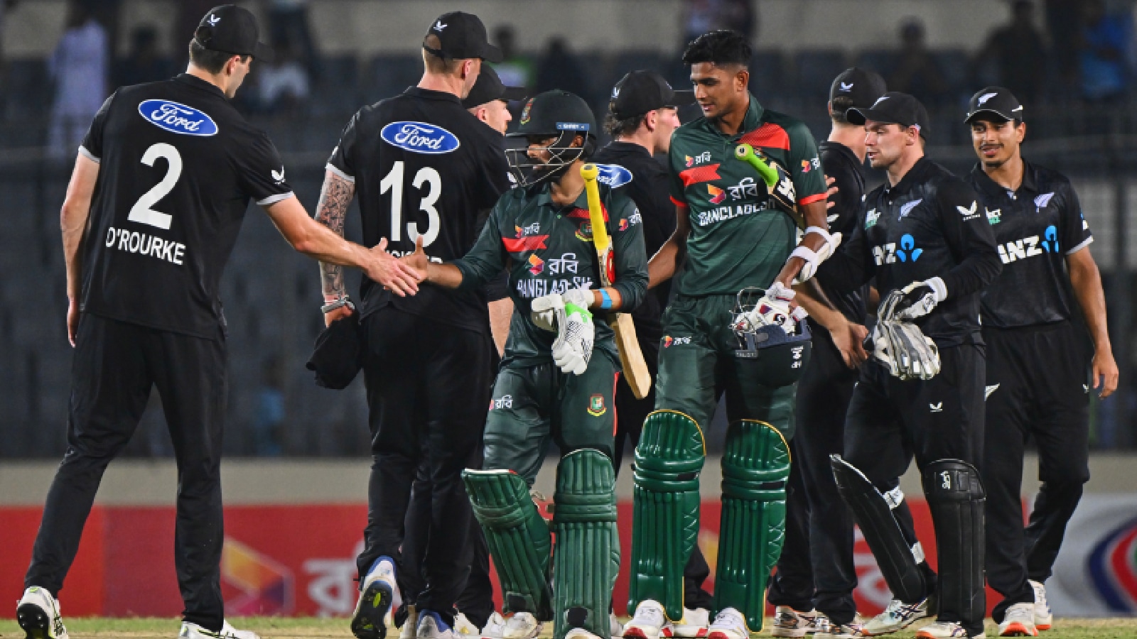 New Zealand's players shake hands with Bangladesh's players after winning the first one day international cricket match between Bangladesh and New Zealand in Mirpur, Bangladesh, Friday, April 17, 2026. (AP Photo)