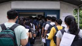 Students standing in a queue for CUET UG