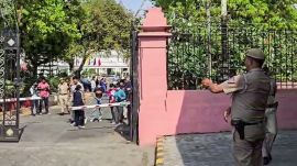 New Delhi, Apr 06 (ANI): Police personnel at Delhi Assembly premises after a car with a Uttar Pradesh registration number forcibly entered Gate No. 2, breaking the iron gate. The driver placed a bouquet there and left. The search for the vehicle is underway, in New Delhi on Monday. (ANI Video Grab)