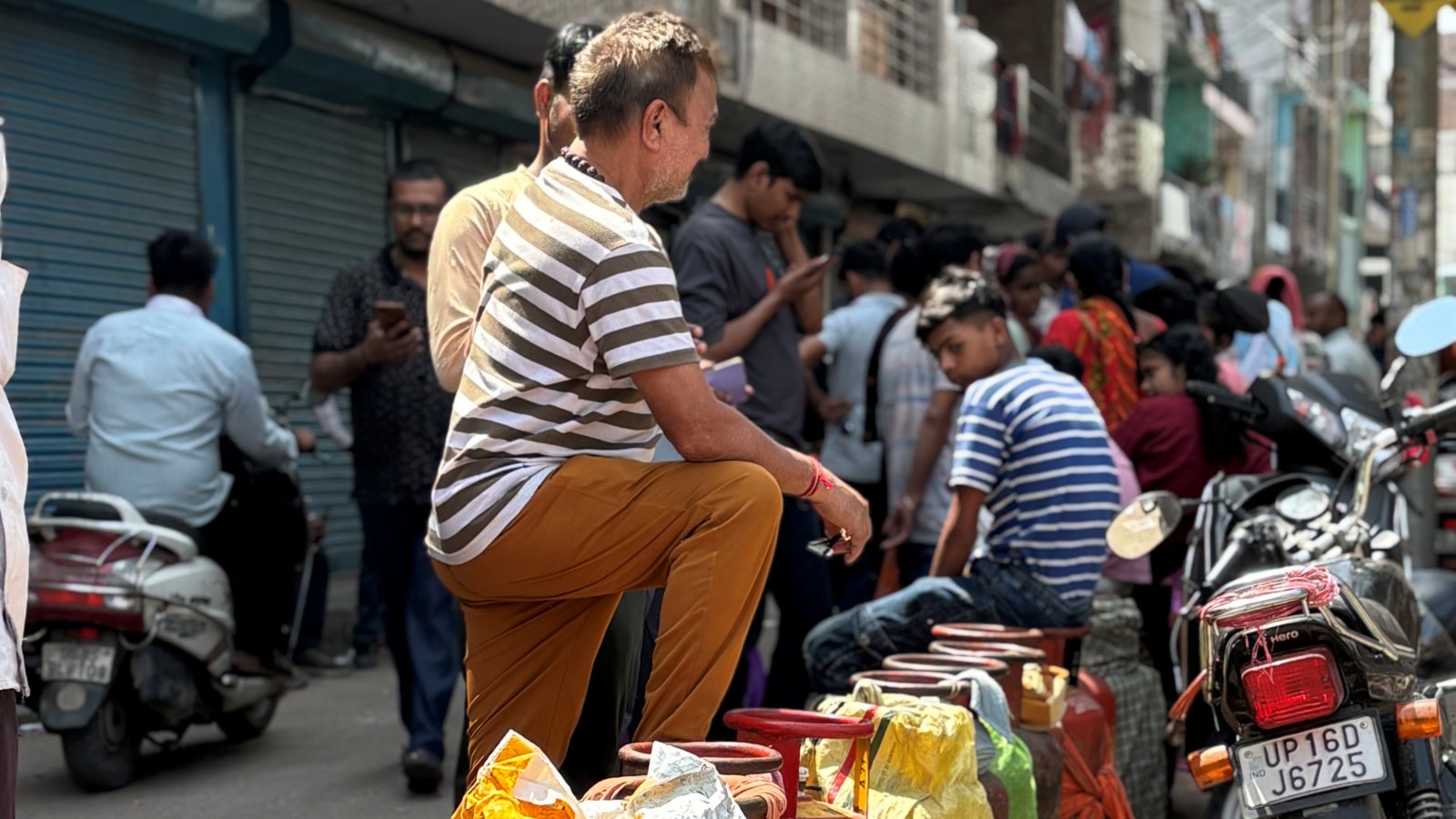 ‘If this was our village, we’d have cooked on a chulha’: Despair and fatigue in long lines for gas in Noida