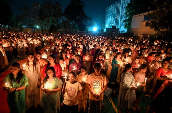 Catholic devotees take part in the Easter Vigil at Queen of Apostles Church, in Patna on Saturday. (ANI Photo)
