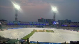 IPL 2026: The Eden Gardens ground under covers a few hours out from the KKR vs PBKS match on Monday. (Express Photo by Sayak Dutta)