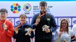 The Indian pair of Palak Gulia and Mukesh Nelavalli pose after winning the title in the 10m air pistol mixed team final in the ISSF World Cup in Granada, Spain. (NRAI)