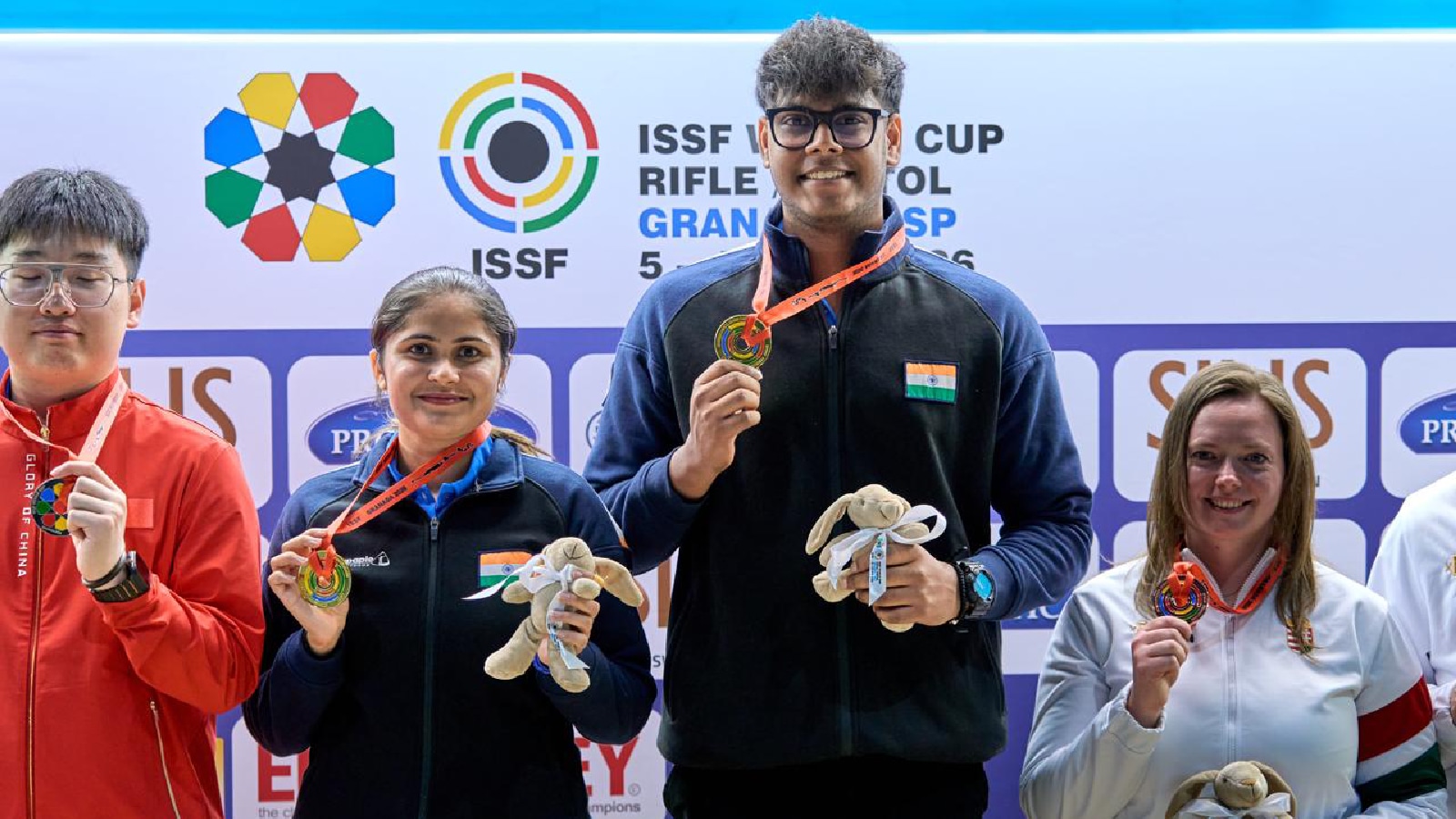 The Indian pair of Palak Gulia and Mukesh Nelavalli pose after winning the title in the 10m air pistol mixed team final in the ISSF World Cup in Granada, Spain. (NRAI)