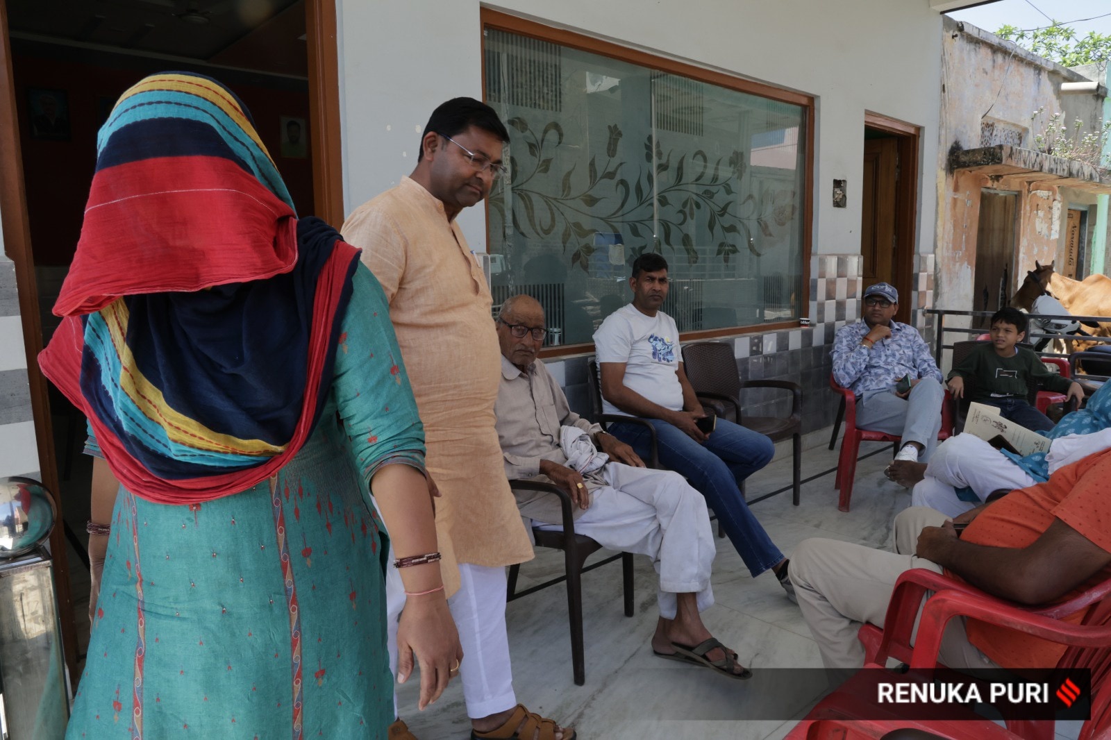 Kavita, sarpanch of Sample village in Rohtak, with her husband and other villagers.