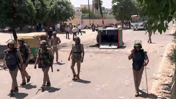 Protesting employees vandalize vehicles and resort to stone-pelting