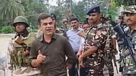 In a video clip, which has gone viral, Ajay Pal Sharma, flanked by gun-wielding Central Armed Police Force (CAPF) personnel, is purportedly seen approaching Khan’s residence, and saying: “Acchi tarah se samajh le ki agar kisi ne badmashi kari, toh uska kayde se ilaz kiya jaayega. (Source: Express Photo)