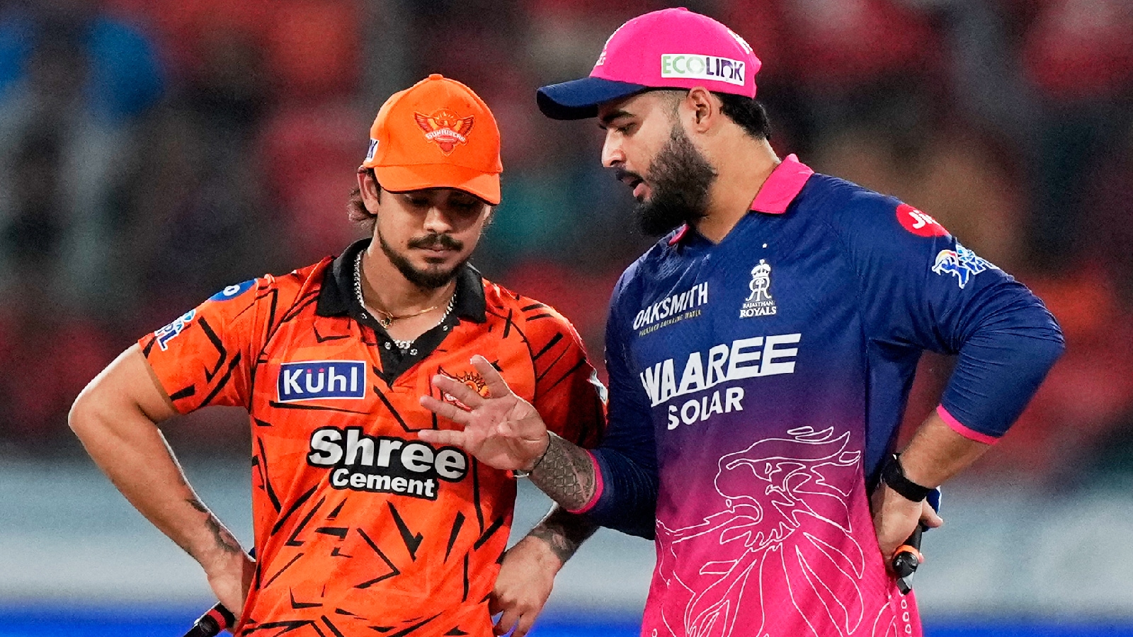 Rajasthan Royals' captain Riyan Parag, right, talks with Sunrisers Hyderabad's captain Ishan Kishan during the toss before the start of the Indian Premier League cricket match between Sunrisers Hyderabad and Rajasthan Royals in Hyderabad, India, Monday, April 13, 2026. (AP Photo)