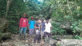 trekker along with a photo of four rescuers flanking her.