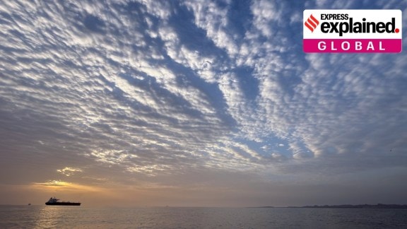 The sun rises behind a tanker anchored in the Strait of Hormuz off the coast of Qeshm Island, Iran, April 18.