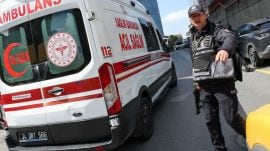 A police officer works at the scene, after gunfire was heard near the building housing the Israeli consulate, according to a witness, in Istanbul, Turkey, April 7, 2026. REUTERS/Murad Sezer
