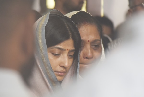 Aparna Yadav along with daughters Prathama Yadav and Pratiksha Yadav at the time of last rides of her Husband Prateek Yadav in Lucknow on thursday. (Express Photo by Vishal Srivastav)