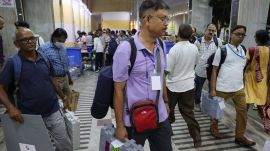 Voting personnel returning return EVMs after polls (Express Photo)