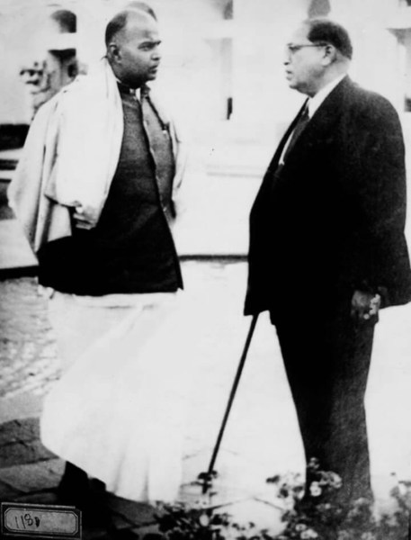 B. R. Ambedkar and Mookerjee talking on the campus of Parliament, 1951 (Wikipedia)