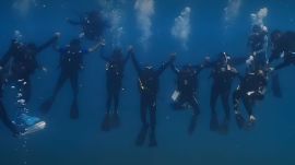 Fourteen divers executed the feat by forming a vertical human stack measuring 22.3 metres in height