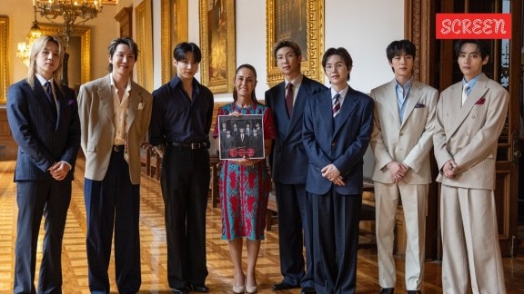 BTS with Mexican president holding album Arirang