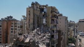 Rescue workers search through the rubble of a building destroyed in an Israeli airstrike the previous day in Dahiyeh, Beiruts southern suburbs, Lebanon, Thursday, May 7, 2026. (AP Photo)