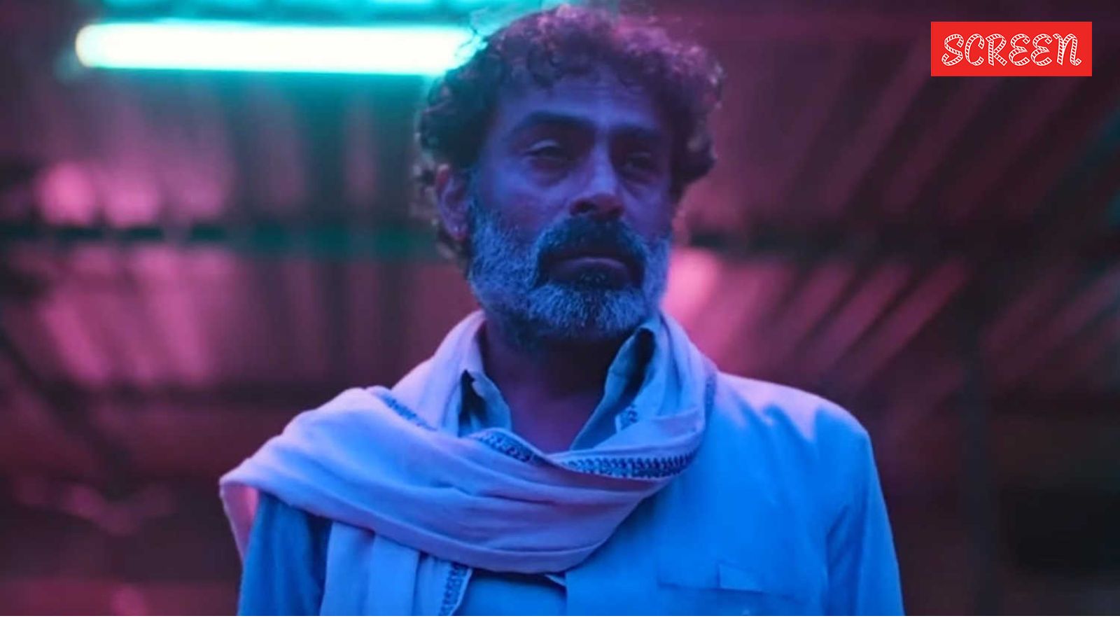 How Dug Dug builds a motorcycle god in its absurdist universe?