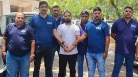 Anand Singh Thakur arrest, Sholay gang UP, Surat crime branch, UP STF encounter fear, Pratapgarh extortion case, Jaunpur school firing, Karanraj Vaghela JCP Surat, gangster arrested Surat Khatodara, Arms Act arrest Gujarat, Bharatiya Nyaya Sanhita BNS 109, UP police bounty criminal, Uttar Pradesh crime news.