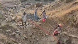 Valsad village women entering dry wells, Valsad village women entering dry wells to seek water, Valsad water supply, Valsad water shortage, Valsad, Indian express news, current affairs