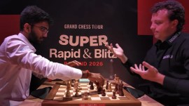 Hans Niemann reacts to world champion D Gukesh pressing his clock while two pieces were still rolling on the board. (Screengrab via Saint Louis Chess Club YouTube)