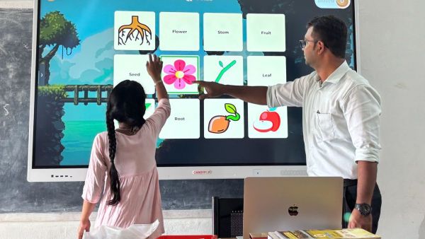 Madhusudhan K S assisting a student at the AI lab as part of his experiential learning methodology (Express photo) 