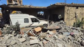 A vehicle remains trapped amid the rubble of a destroyed building in the Lebanese town of Habboush, following Israeli strikes, Nabatieh Governorate, on May 2, 2026. (REUTERS)