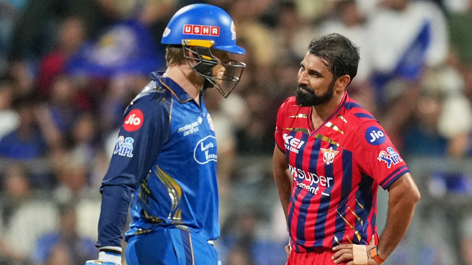 Lucknow Super Giants' Mohammed Shami, right, reacts after Mumbai Indians' Ryan Rickelton hits a boundary during the Indian Premier League cricket match between Mumbai Indians and Lucknow Super Giants in Mumbai on Monday. (AP Photo)
